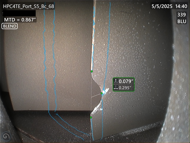Engineer measuring the depth of an HPC blade blend repair